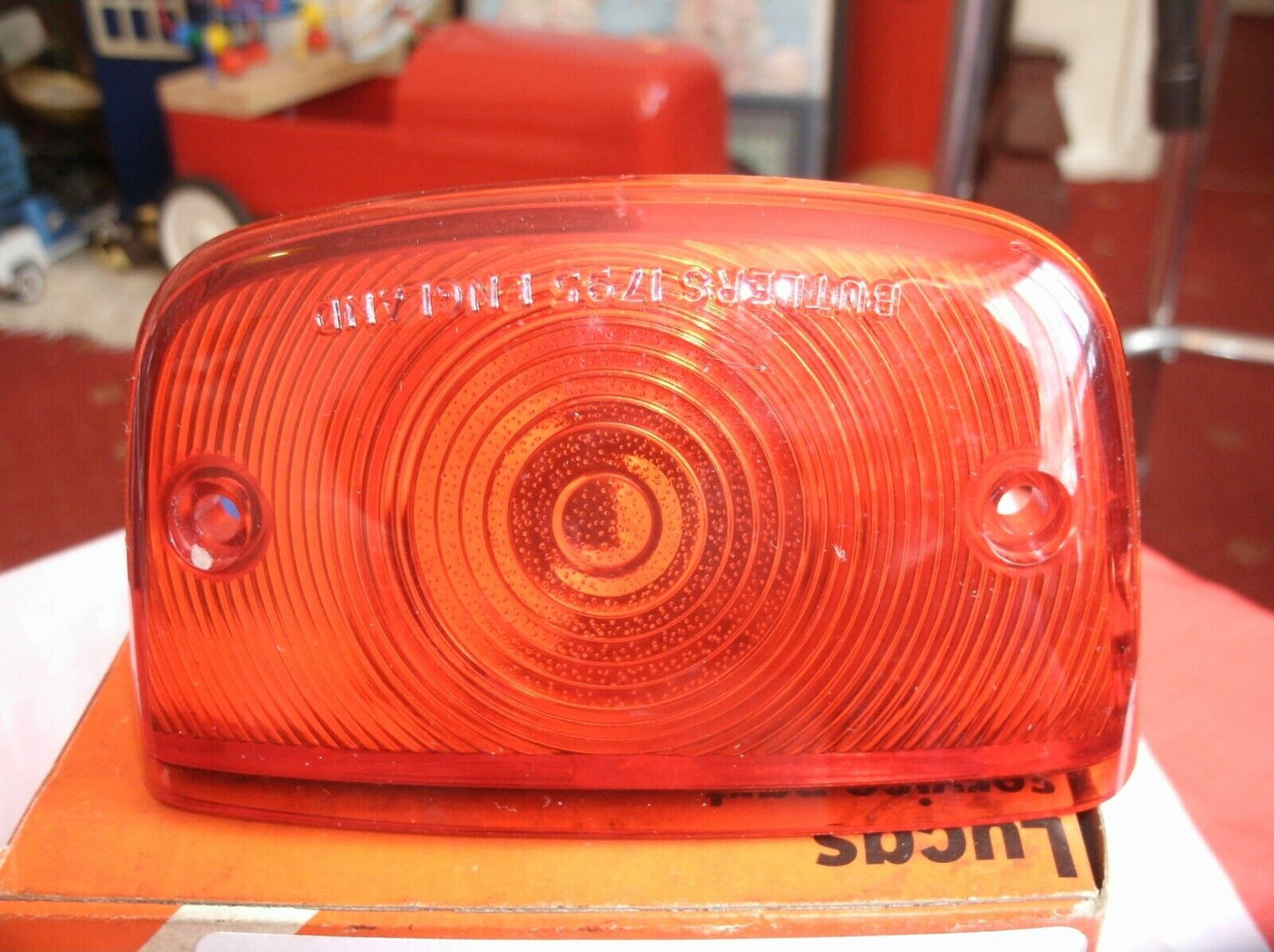 One New Old Stock Red Bedford TK Rear Light Lens Lucas Butlers With Fitting Kit.