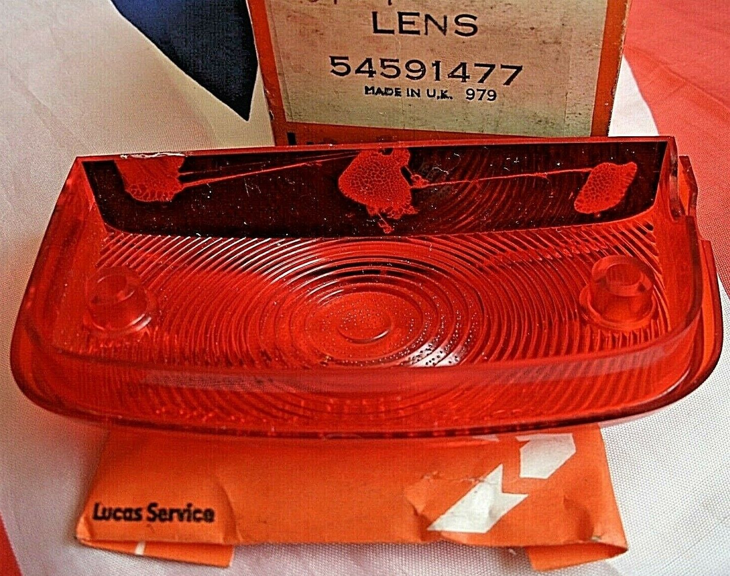 One New Old Stock Red Bedford TK Rear Light Lens Lucas Butlers With Fitting Kit.